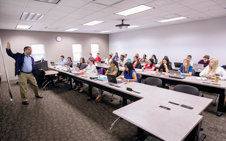Professor presenting in a classroom.