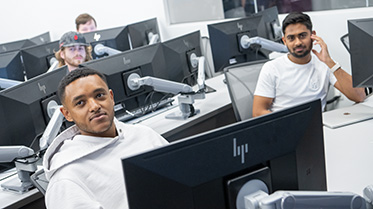 Students learning in a computer science course.